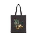Black tote bag with cowboy boots and hat design on a white background