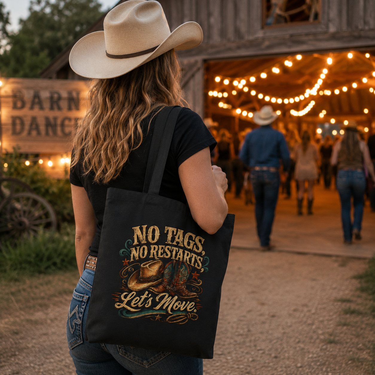 Person holding a tote bag with a cowboy-themed design at a barn dance event.
